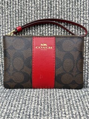COACH Brown Signature Canvas Wristlet with Red Center Stripe